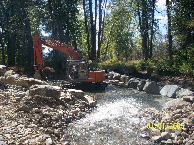 Structure and bank work beside live water